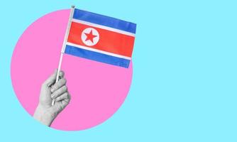 een collage van modern kunst. vrouw hand- Holding noorden Korea vlag in een cirkel, neon achtergrond, met ruimte voor tekst. foto