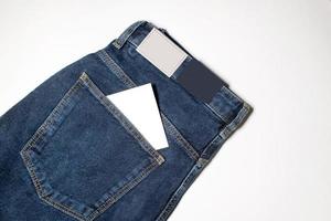 een leeg Notitie in de zak- van jeans foto