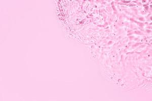roze abstract water achtergrond structuur met rimpelingen en golven foto