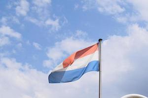 Nederlands vlag in de wind foto