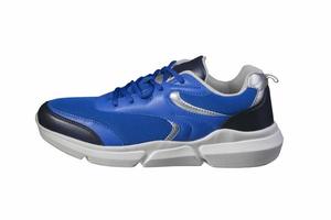 blauw sneaker gemaakt van kleding stof Aan een wit achtergrond kant visie. sport schoenen. foto