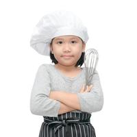 gelukkig Aziatisch meisje chef Holding Koken gereedschap foto