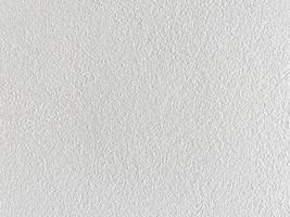 naadloze textuur van witte cementmuur een ruw oppervlak, met ruimte voor tekst, voor een achtergrond.. foto