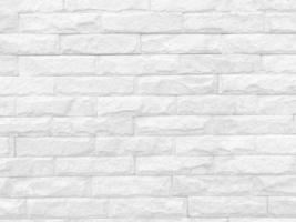 naadloze textuur van witte stenen muur een ruw oppervlak, met ruimte voor tekst, voor een achtergrond. foto