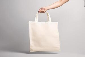 hand- Holding een blanco canvas tote zak Product Aan wit achtergrond generatief ai foto