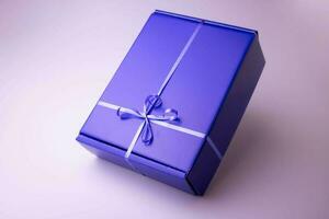blauw geschenk Gesloten doos met lint Aan roze achtergrond foto