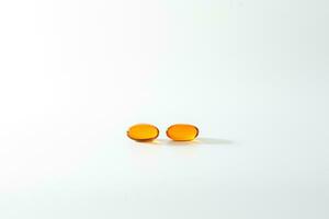 zacht gel, dichtbij omhoog van olie gevulde capsules, geschikt voor presenteren voedsel supplementen, vis olie, omega 3, omega 6, omega 9, vitamine a, vitamine d, vitamine d3, vitamine e, avond sleutelbloem olie, foto