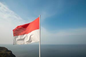 Indonesië nationaal vlag golvend in de blauw lucht Aan de oceaan achtergrond. rood en wit vlag met wolken. ai gegenereerd foto