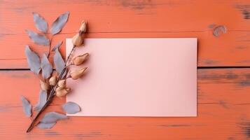 roze blanco papier kaart model, droog bladeren en zaad peulen Afdeling Aan oranje houten structuur tafel top. generatief ai. foto