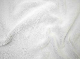 witte schone wol textuur achtergrond. lichte natuurlijke schapenwol. witte naadloze katoen. textuur van pluizige vacht voor ontwerpers. close-up fragment wit wollen tapijt. foto