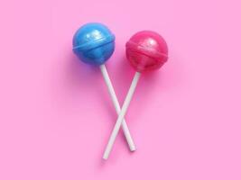 roze en blauw lolly geïsoleerd Aan roze achtergrond. 3d renderen foto