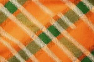 oranje kleding stof textiel patroon, plaid achtergrond, linnen katoen. ai generatief foto