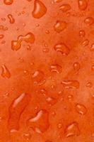 close-up abstracte gestructureerde achtergrond van een oranje pompoen foto