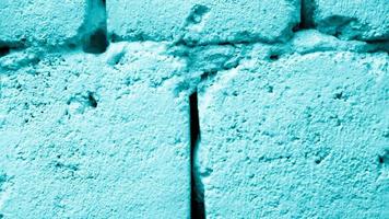 oude blauwe bakstenen muur textuur achtergrond close-up foto