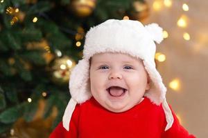 kerstbaby lacht foto