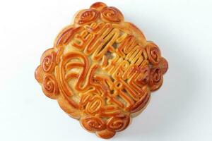 Chinese gebakken versierd mooncake midden herfst festival plein maan taart vulling geschenk wens aanbieden Aan wit achtergrond foto