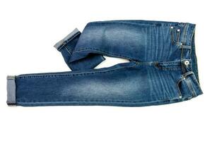 blauw jeans denim broek samenstelling modern vrouwen en Mannen mode broek structuur geïsoleerd Aan wit achtergrond foto