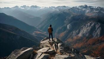 een persoon staand Aan top van berg piek, backpacken succes gegenereerd door ai foto