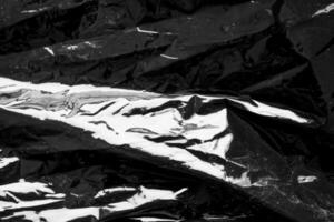 zwart transparant plastic film inpakken bedekking structuur achtergrond foto