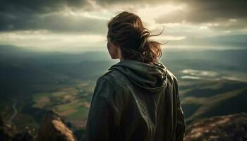 een jong vrouw staand Aan berg piek, op zoek Bij visie gegenereerd door ai foto
