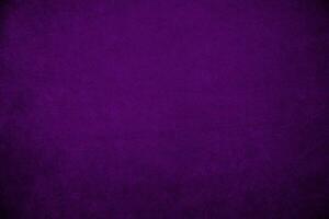 Purper fluweel kleding stof structuur gebruikt net zo achtergrond. paars kleding stof achtergrond van zacht en glad textiel materiaal. Daar is ruimte voor tekst. foto