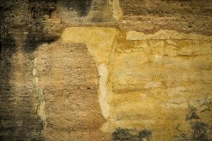 gele oude vuile betonnen muur textuur of achtergrond