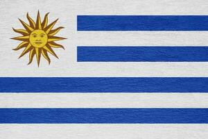 vlag van oostelijk republiek van Uruguay Aan een getextureerde achtergrond. concept collage. foto