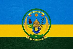vlag van republiek van rwanda Aan een getextureerde achtergrond. concept collage. foto