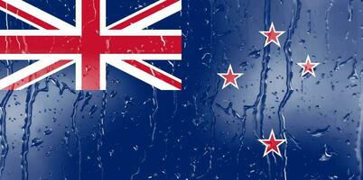 3d vlag van nieuw Zeeland Aan een glas met water laten vallen achtergrond. foto