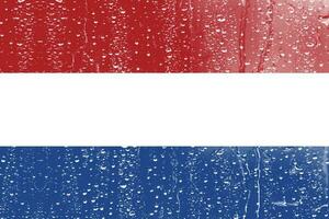 3d vlag van Nederland Aan een glas met water laten vallen achtergrond. foto