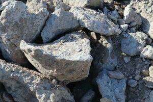 zand en stenen Aan een grind grond structuur in hoog oplossing. foto