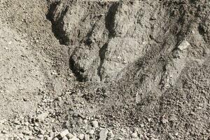 zand en stenen Aan een grind grond structuur in hoog oplossing. foto