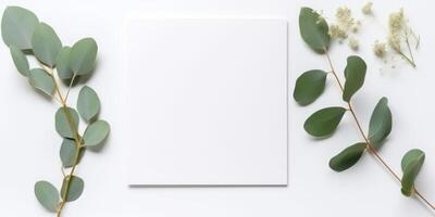 minimalistische groet kaart mockup met delicaat droog eucalyptus bladeren - top visie Aan een schoon wit achtergrond, ai gegenereerd foto