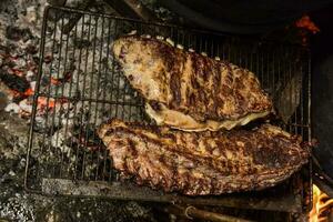 varken ribben barbecue , Patagonië, Argentinië foto