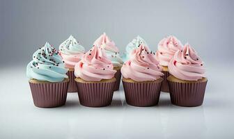 cupcakes met blauw en roze decoratie Aan wit achtergrond, dichtbij omhoog visie. ai gegenereerd foto