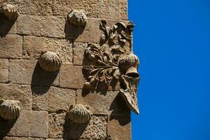 detail van decoraties Aan de facade van de historisch huis van de schelpen gebouwd in 1517 door rodrigo aria's de maldonado ridder van de bestellen van Santiago de compostela in Salamanca, Spanje foto