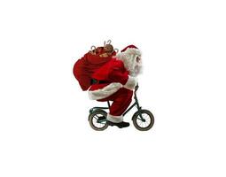 Kerstman ritten fiets naar leveren snel Kerstmis cadeaus foto