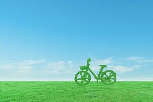 groen ecologisch fiets Aan gras veld- en blauw lucht achtergrond. milieuvriendelijk vriendelijk concept foto