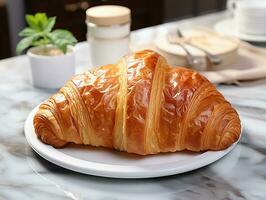 fotografie van Frans croissant Aan de wit marmeren tafel ai gegenereerd foto