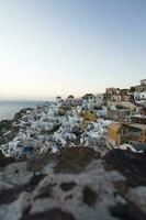 oia dorp Aan Santorini eiland in Griekenland Bij zonsondergang foto