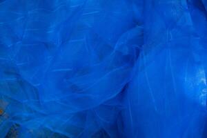 doorzichtig blauw netto kleding stof kan worden gebruikt net zo een achtergrond behang foto