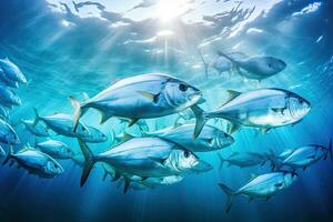 onderwater- visie van een school- van geelvintonijn trevally vis. een groot school- van trevally in een diep blauw tropisch oceaan, ai gegenereerd foto