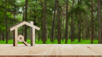 mockup houten huis en sleutel Aan houten tafel, concept van echt landgoed investering. planning spaargeld geld van munten kopen huis concept voor eigendom, hypotheek en echt landgoed investering. foto