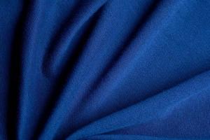 blauwe stof textuur achtergrond, abstract, close-up textuur van doek foto