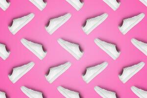 patroon van wit sportschoenen geïsoleerd Aan roze achtergrond. sportief paar- van schoenen voor model. modieus elegant sport- gewoontjes schoenen. modern en minimalistische behang. foto