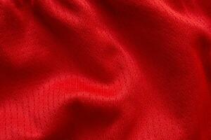 rood sport- kleding kleding stof Amerikaans voetbal overhemd Jersey structuur achtergrond foto