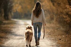 jong vrouw wandelen haar hond in de park in herfst dag, ai gegenereerd foto