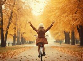 herfst achtergrond met vrouw en fiets foto