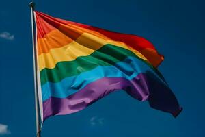 een regenboog vlag golvend in de wind foto