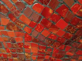 abstract vlak structuur en achtergrond van rood graniet stukken mozaïek. foto